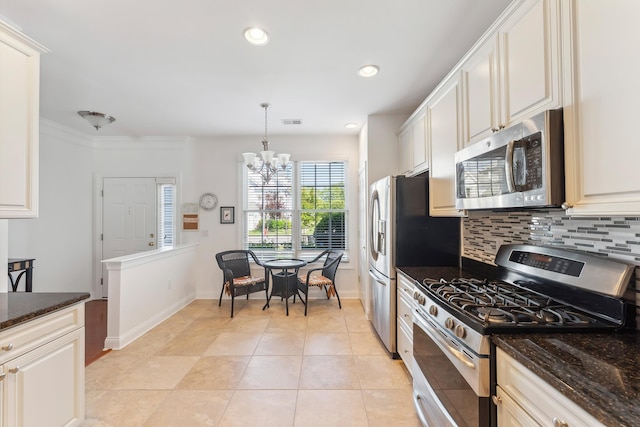 7 Herron Ct Unit 40, Cape May Court House, NJ 08210 - kitchen with appliances with stainless steel finishes, a chandelier, baseboards, tasteful backsplash, and dark stone countertops