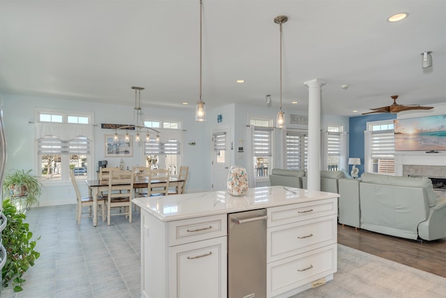 kitchen with white cabinets, recessed lighting, and a healthy amount of sunlight