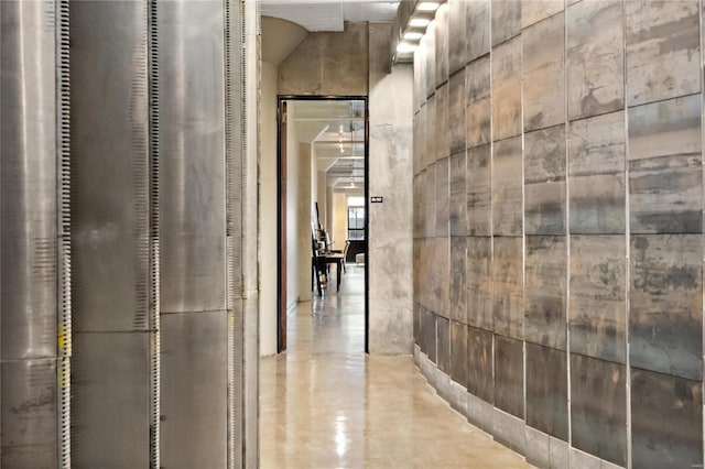 corridor with concrete flooring