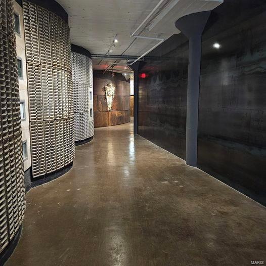 hallway with concrete floors