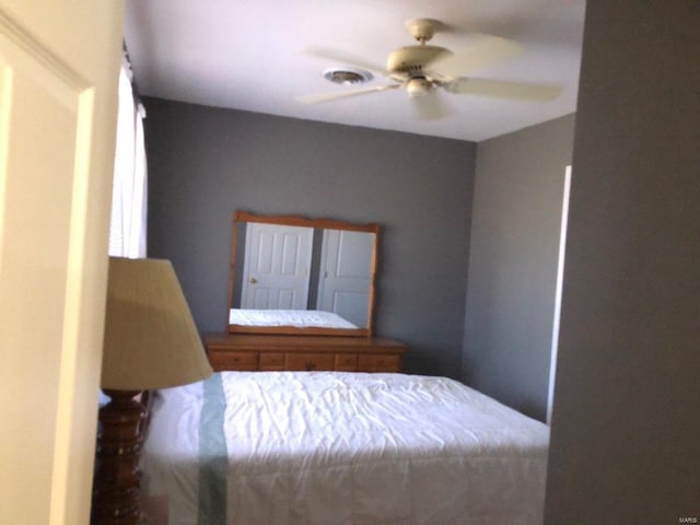 unfurnished bedroom featuring ceiling fan