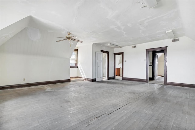 additional living space with dark wood-type flooring and ceiling fan