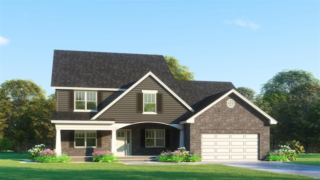 view of front of house with a front yard and a garage