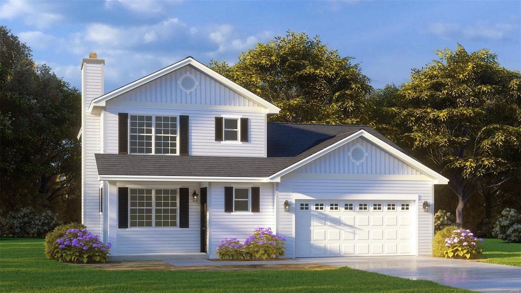 view of front of home with a front lawn and a garage