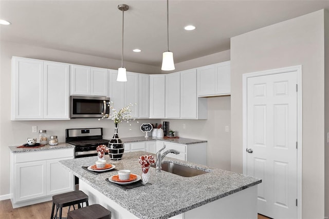 kitchen featuring a center island with sink and appliances with stainless steel finishes