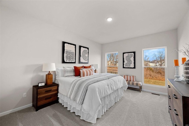 bedroom with light colored carpet