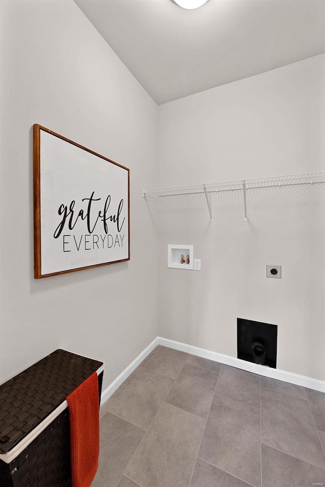 clothes washing area featuring washer hookup, hookup for an electric dryer, and light tile floors