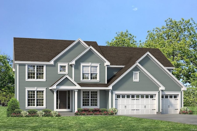 view of front of property with a front yard and a garage