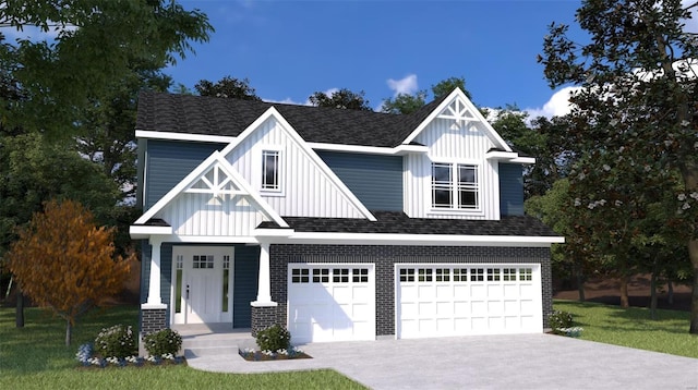 view of front facade with a front yard and a garage