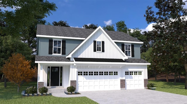 view of front of property with a front lawn and a garage