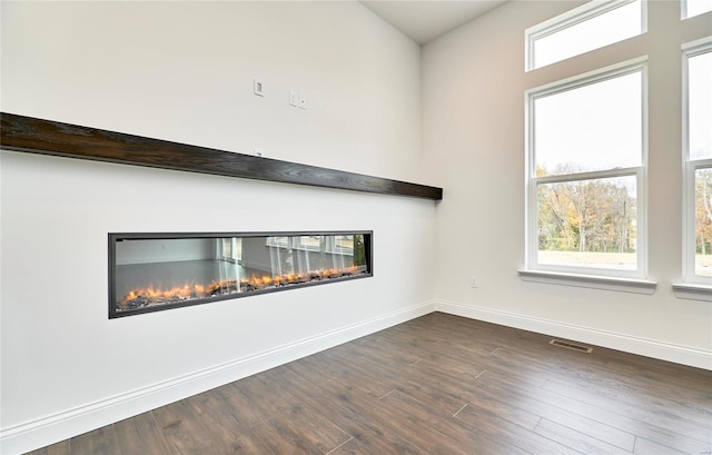 spare room with dark hardwood / wood-style flooring