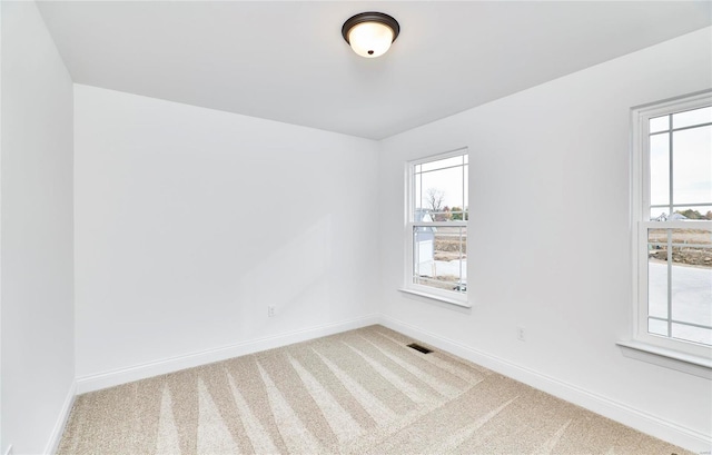 view of carpeted spare room