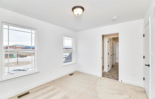 view of carpeted spare room