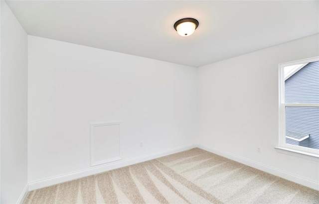 unfurnished room with plenty of natural light and light colored carpet