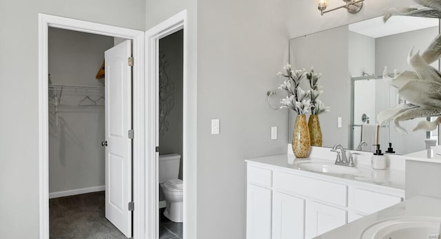 bathroom with oversized vanity, tile flooring, and toilet