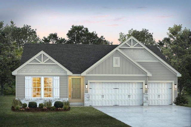 view of front of house with a lawn and a garage