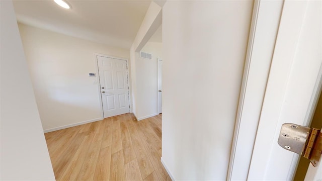 hall with light wood-type flooring