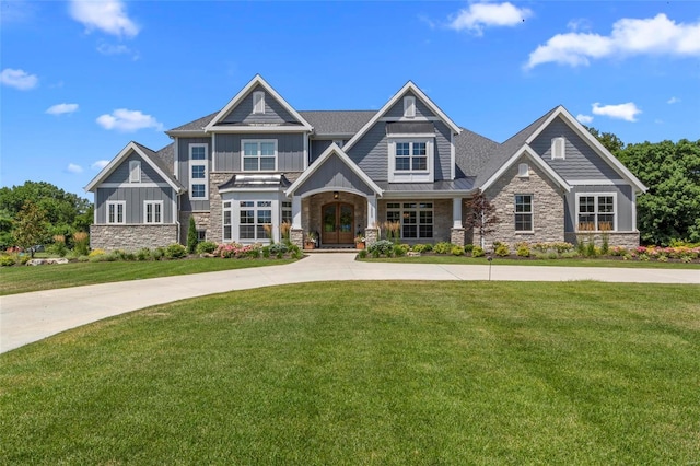 craftsman inspired home with a front lawn