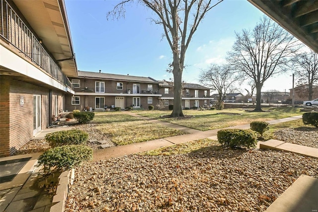 view of yard with a balcony