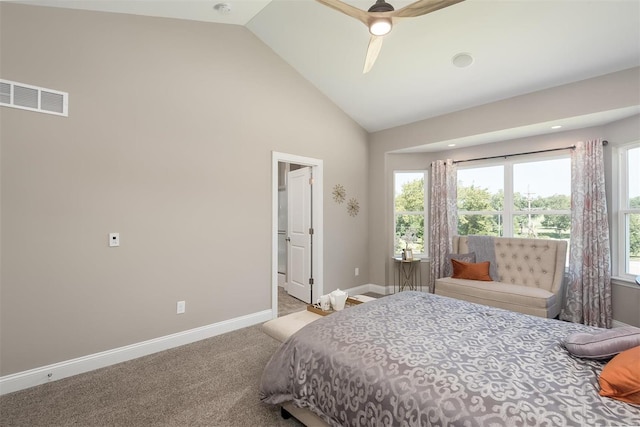 carpeted bedroom with ceiling fan and high vaulted ceiling