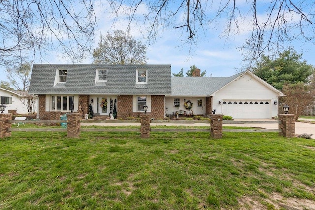 view of front of property with a front lawn and a garage