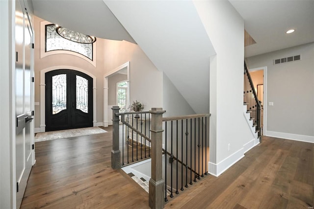 entrance foyer featuring french doors and dark hardwood / wood-style floors