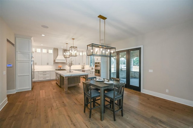 dining area featuring dark hardwood / wood-style flooring and sink