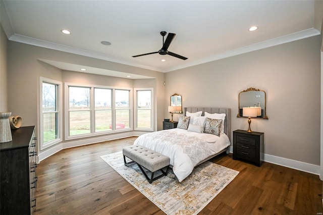 bedroom with ceiling fan, dark wood-type flooring, and ornamental molding