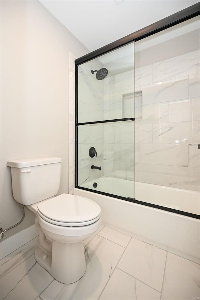 bathroom with toilet and enclosed tub / shower combo