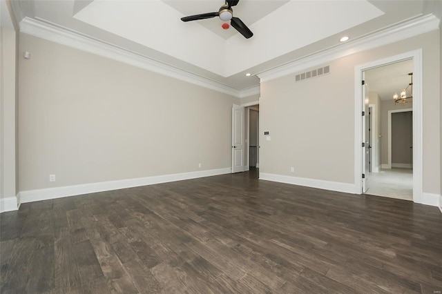 unfurnished room with crown molding, visible vents, and dark wood-type flooring