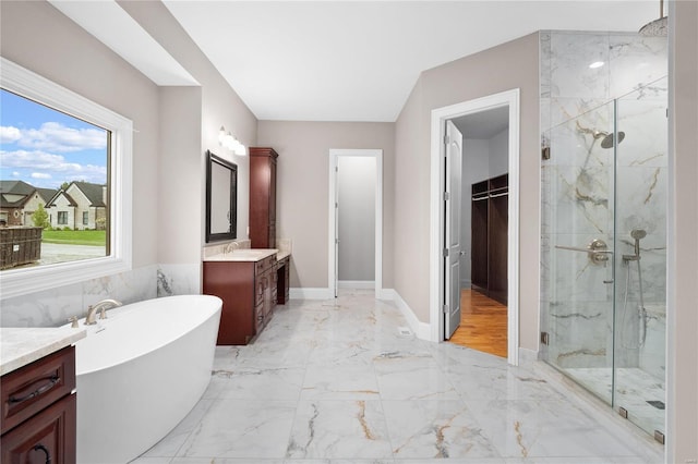 bathroom with shower with separate bathtub, vanity, and hardwood / wood-style flooring