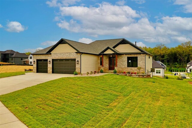 craftsman house featuring a garage and a front lawn