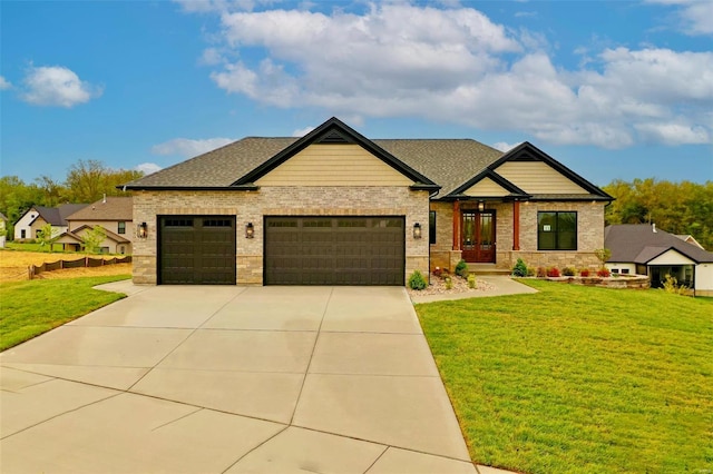 craftsman inspired home with a garage and a front lawn