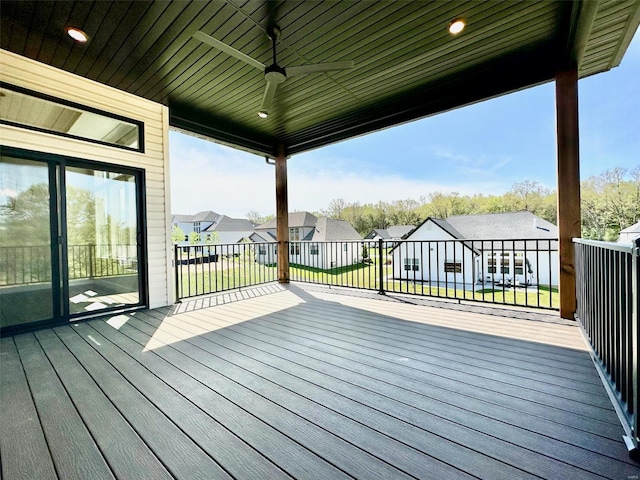 wooden terrace with a yard and ceiling fan