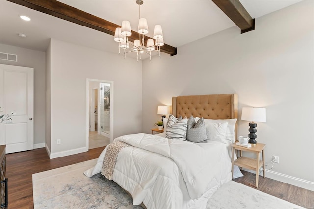 bedroom featuring ensuite bath, dark wood-type flooring, a chandelier, and beamed ceiling