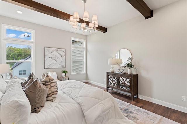 bedroom with beamed ceiling, dark hardwood / wood-style floors, and an inviting chandelier