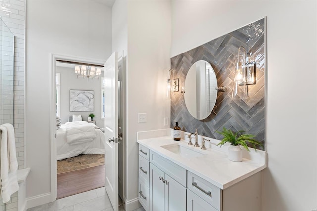 bathroom featuring vanity and backsplash