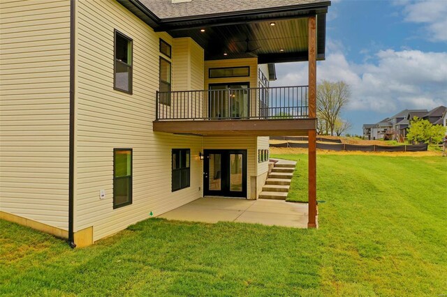 back of property featuring a yard and a patio area