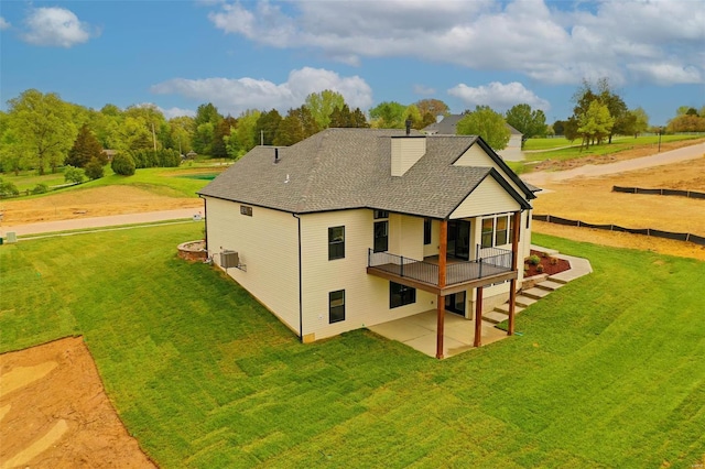 back of house with cooling unit, a lawn, a deck, and a patio area