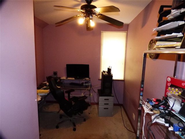 home office featuring light carpet and ceiling fan