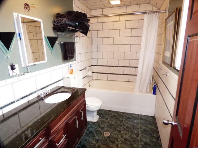 full bathroom with shower / bathtub combination with curtain, toilet, tile floors, and vanity with extensive cabinet space