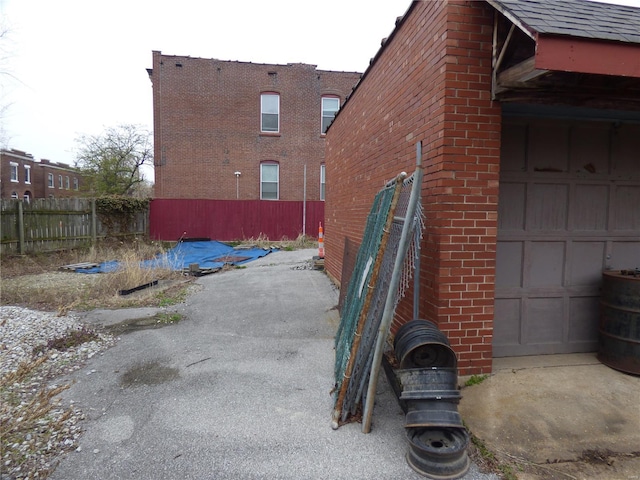 view of property exterior featuring a garage