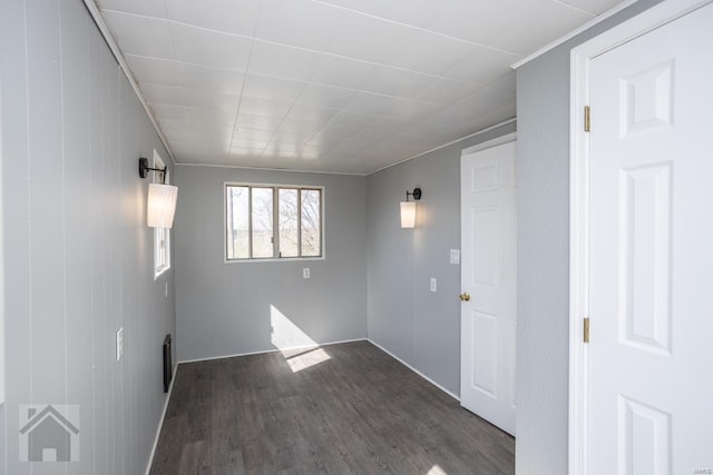 empty room featuring dark wood-type flooring