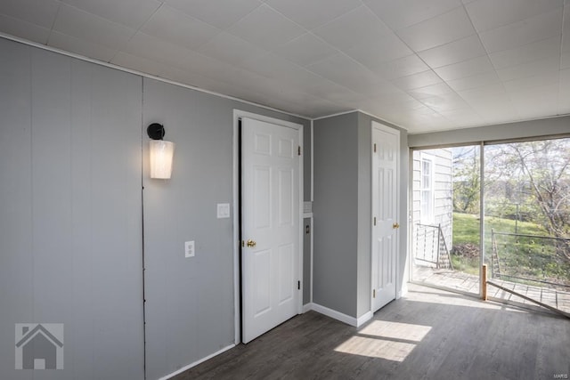 unfurnished room featuring dark hardwood / wood-style floors