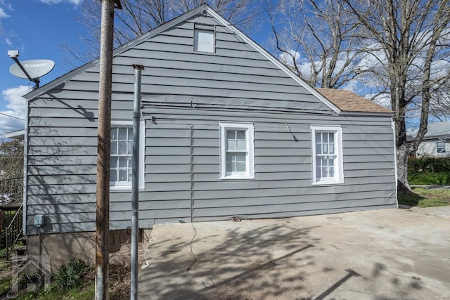 view of side of home featuring a patio