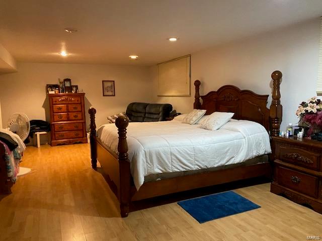 bedroom with light wood-type flooring