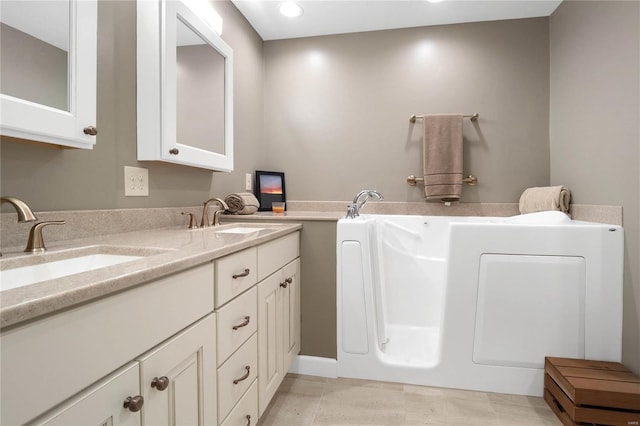 bathroom featuring dual bowl vanity and tile flooring