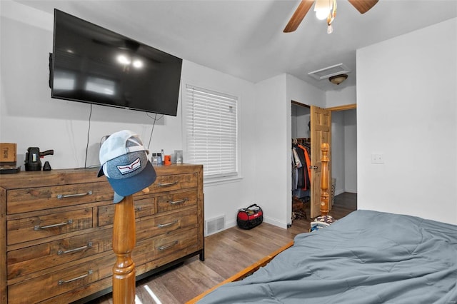 bedroom featuring a closet, hardwood / wood-style flooring, and ceiling fan