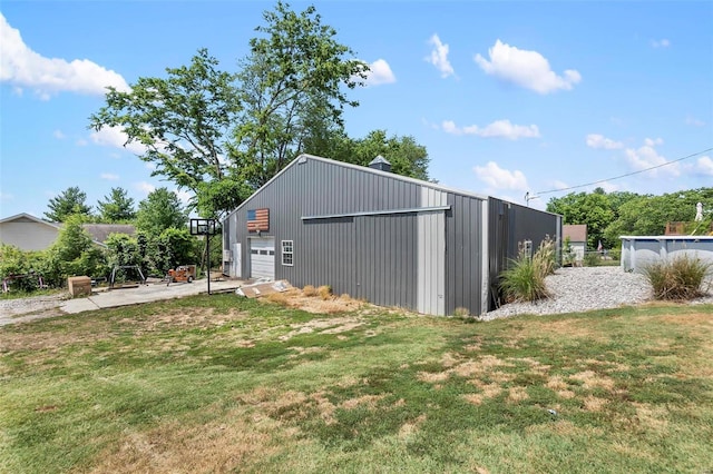 view of outdoor structure featuring a lawn