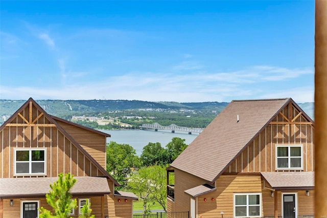 water view featuring fence and a mountain view